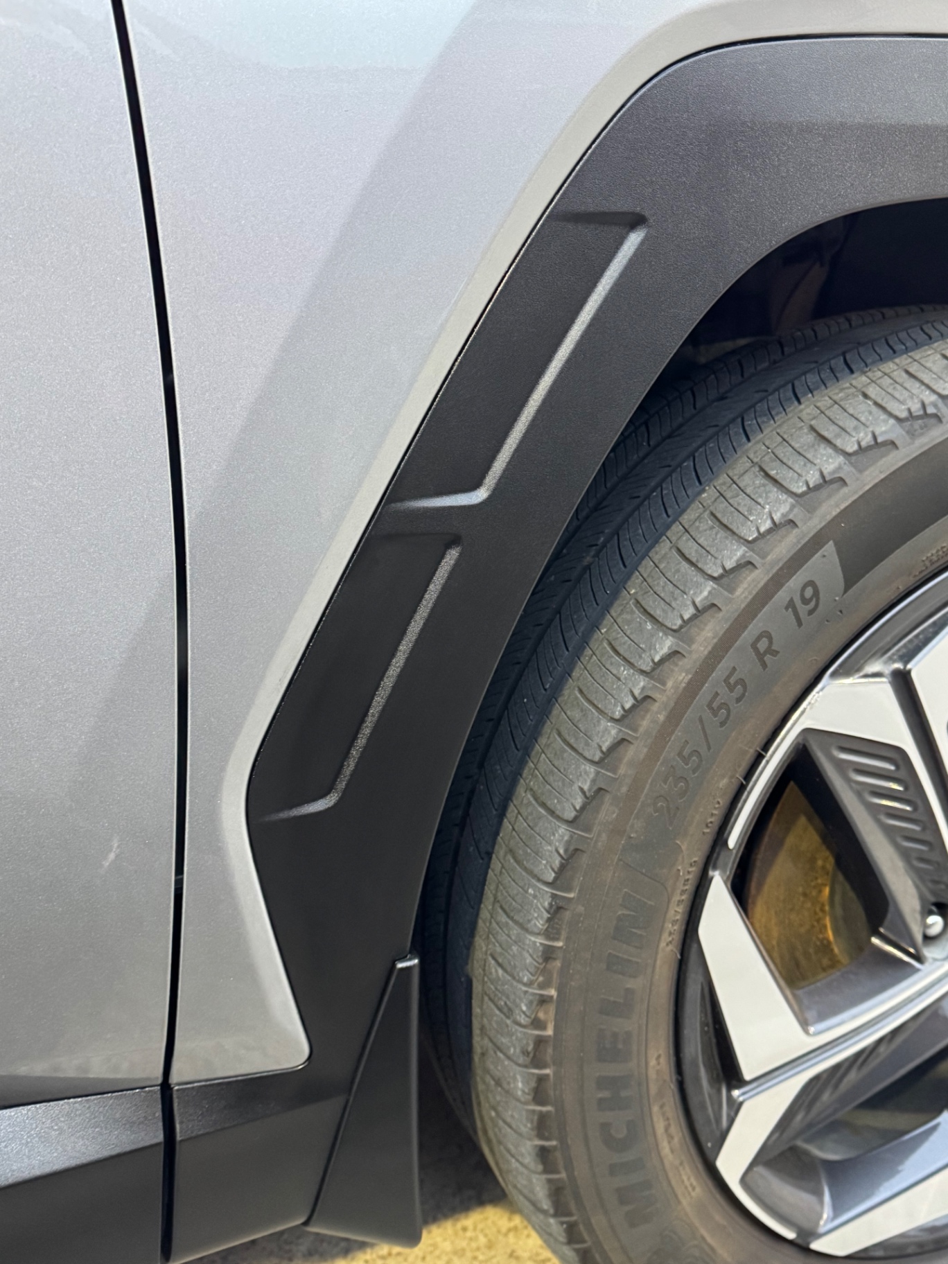 After photo of SUV fender flare restored to deep factory black satin finish