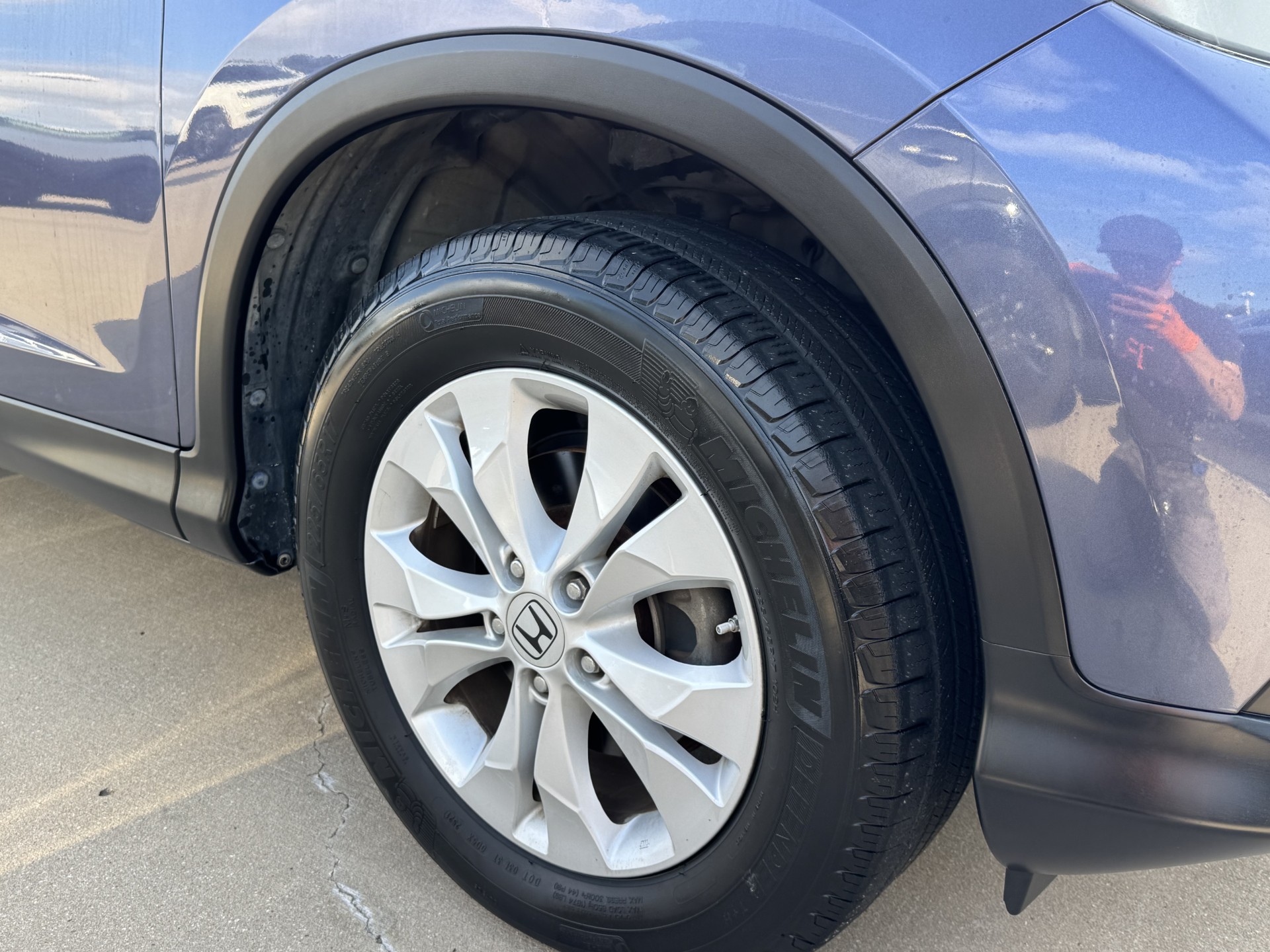 After photo of front fender flare restored to natural black