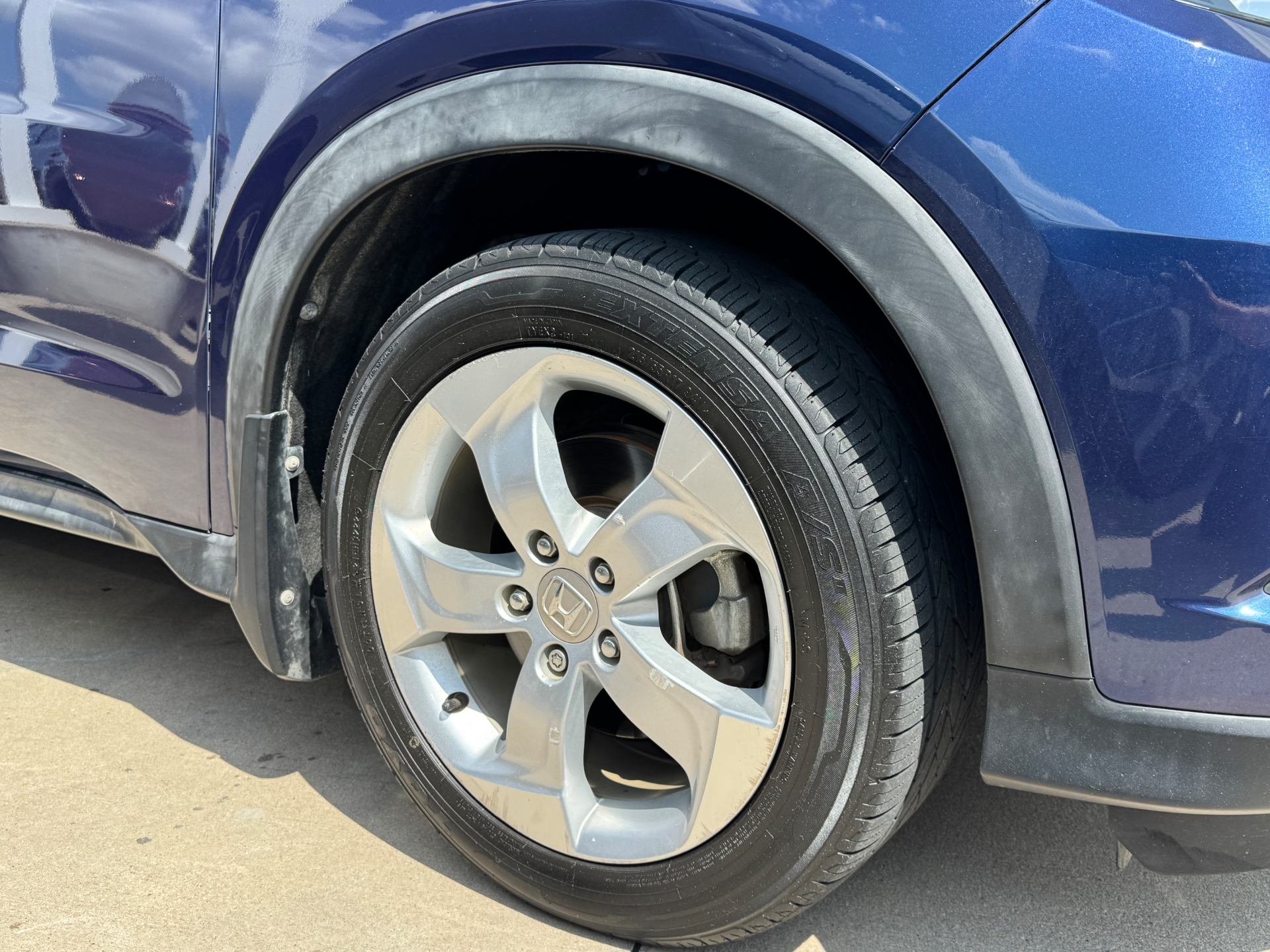 Before photo of faded Honda fender trim